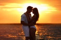 Happy young couple  time together on  beach at sunset Royalty Free Stock Photo