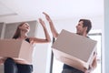 Happy young couple standing on the doorstep of their new apartment Royalty Free Stock Photo