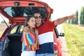 Happy young couple standing near car Royalty Free Stock Photo