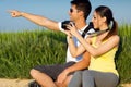 Happy Young couple taking photos in the field Royalty Free Stock Photo