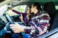 Happy young couple taking selfie on the phone in the car Royalty Free Stock Photo