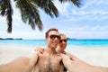 Happy young couple taking selfie photo on the beach Royalty Free Stock Photo