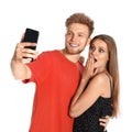 Happy young couple taking selfie on white Royalty Free Stock Photo