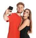 Happy young couple taking selfie on white Royalty Free Stock Photo