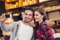 Happy young couple taking selfportrait