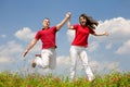 Happy Young Couple - team is jumping Royalty Free Stock Photo