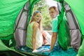 Happy young couple in a tent.