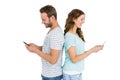 Happy young couple text messaging on mobile phone Royalty Free Stock Photo