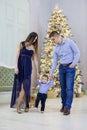 Happy young couple and their baby son near Christmas tree at home Royalty Free Stock Photo