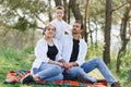 Happy young couple with their children have fun at beautiful park outdoor in nature Royalty Free Stock Photo