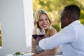 Happy young couple toasting wineglasses at restaurant Royalty Free Stock Photo