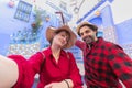 Happy young couple tourist taking selfie on a street in Medina of the blue town of Chefchaouen, Morocco Royalty Free Stock Photo