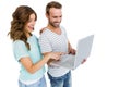 Happy young couple using laptop Royalty Free Stock Photo