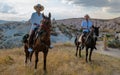 happy young couple on vacation Turkey Kapadokya horse riding in the mountains of Cappadocia Goreme Royalty Free Stock Photo