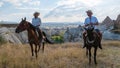 happy young couple on vacation Turkey Kapadokya horse riding in the mountains of Cappadocia Goreme Royalty Free Stock Photo