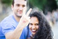 Happy young couple with visible lipstick print on his hand Royalty Free Stock Photo