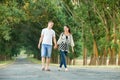 Happy young couple walk on country road outdoor, romantic people concept, summer season Royalty Free Stock Photo