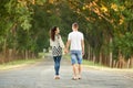 Happy young couple walk on country road outdoor, romantic people concept, summer season Royalty Free Stock Photo