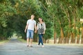 Happy young couple walk on country road outdoor, romantic people concept, summer season Royalty Free Stock Photo