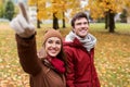 Happy young couple walking in autumn park Royalty Free Stock Photo