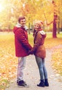 Happy young couple walking in autumn park Royalty Free Stock Photo