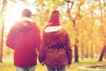 Happy young couple walking in autumn park Royalty Free Stock Photo