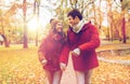 Happy young couple walking in autumn park Royalty Free Stock Photo