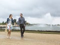 Happy Young Couple Walking in a French Garden