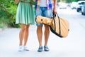 Happy young couple walking with guitar drinking juice spending c Royalty Free Stock Photo