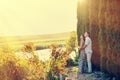 Happy young couple watching sunset in a summer park Royalty Free Stock Photo