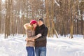 Happy Young Couple in Winter Park having fun. Family Outdoors. love Royalty Free Stock Photo