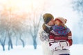 Happy Young Couple in Winter Park laughing and having fun. Family Outdoors. Royalty Free Stock Photo