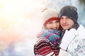 Happy Young Couple in Winter Park laughing and having fun. Family Outdoors. Royalty Free Stock Photo