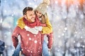 Happy Young Couple in Winter Park laughing and having fun. Family Outdoors. Royalty Free Stock Photo