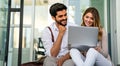 Happy young couple working studying on laptop and digital devices. Business education people concept Royalty Free Stock Photo