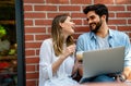 Happy young couple working studying on laptop and digital devices. Business education people concept Royalty Free Stock Photo