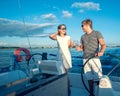 Happy young couple on a yacht