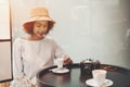 Cheerful African-American girl in cafe drinking coffee Royalty Free Stock Photo