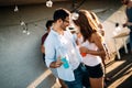 Happy young dancing couple having fun and enjoying party at summer Royalty Free Stock Photo