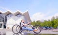 Happy young disable man is riding hand bike Royalty Free Stock Photo
