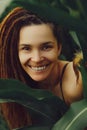 Happy young dredlocks girl in cornfield