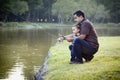 Happy Young Ethnic Father and Son Fishing Royalty Free Stock Photo