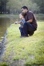 Happy Young Ethnic Father and Son Fishing Royalty Free Stock Photo