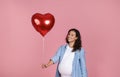 Happy young expecting woman celebrating Valentines Day Royalty Free Stock Photo