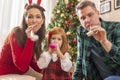 Parents playing with daughter on Christmas day Royalty Free Stock Photo
