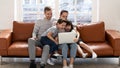 Happy young family with kids have fun using laptop Royalty Free Stock Photo