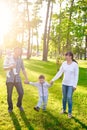 Happy young family with children walks in the summer park Royalty Free Stock Photo