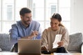 Happy young family couple planning monthly budget. Royalty Free Stock Photo