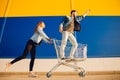 Happy young family couple run with cart to store supermarket for shopping. Lifestyle concept Royalty Free Stock Photo