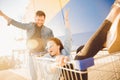 Happy young family couple run with trolley cart to store supermarket for shopping. Lifestyle concept Royalty Free Stock Photo